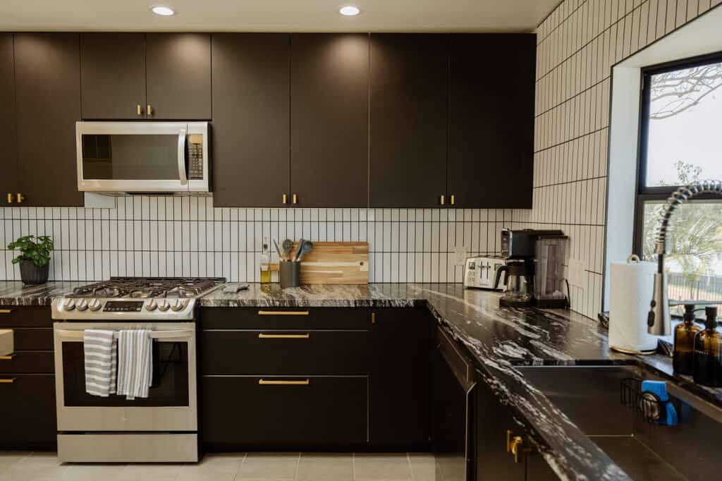 my airbnb kitchen with stove and microwave