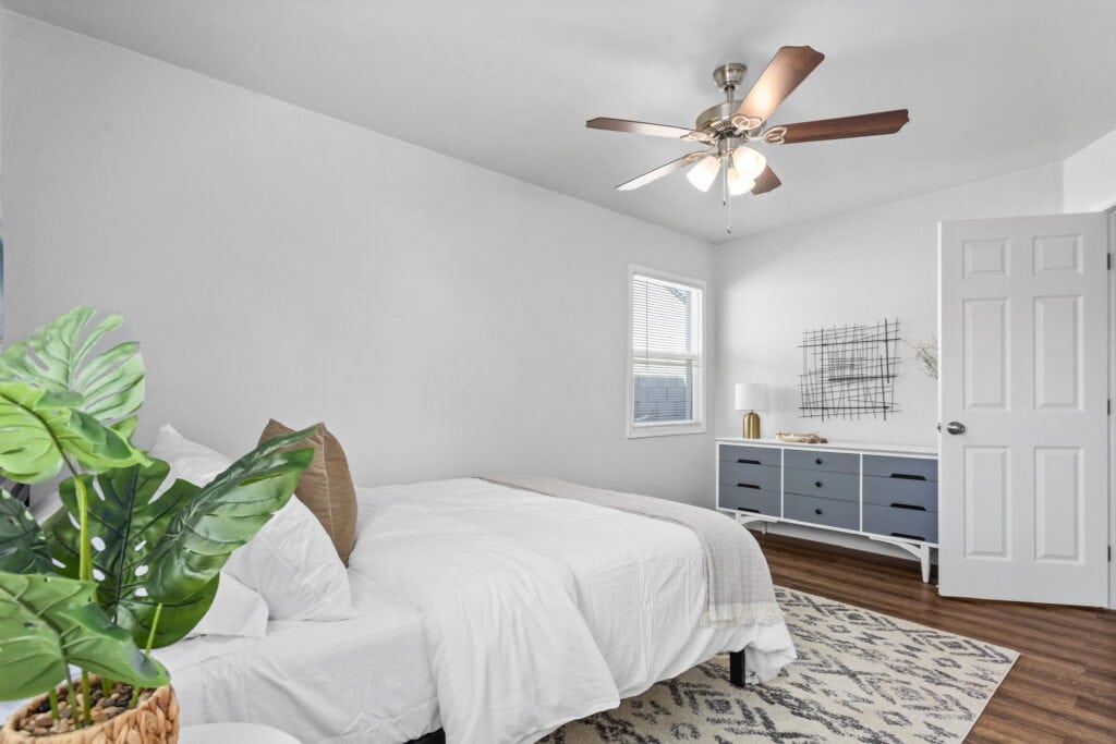 bedroom with queen bed and dresser