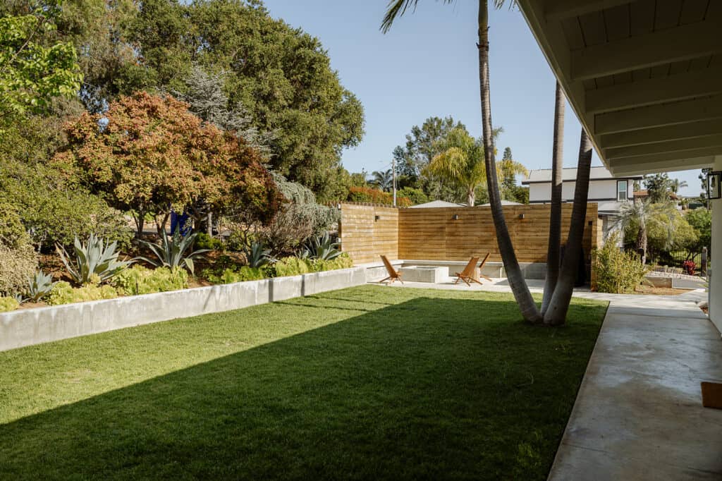 shot overlooking a grass courtyard, firepit area