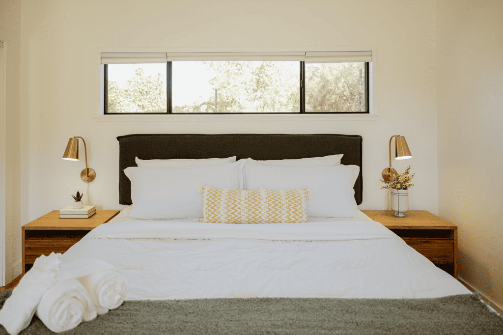 king size bed with nightstands and bedside lamps 