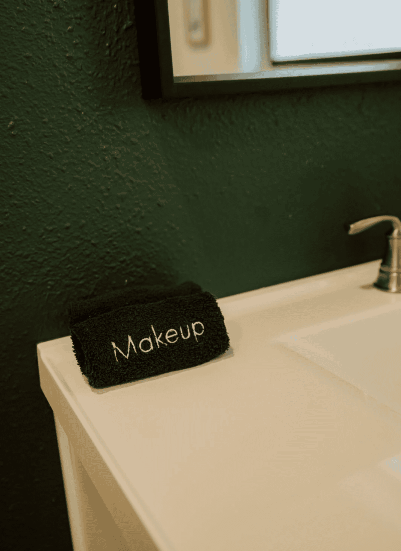 a black makeup towel in an airbnb bathroom