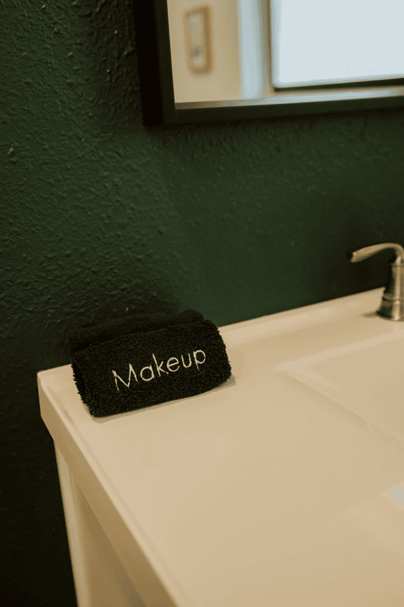 a black makeup towel in an airbnb bathroom