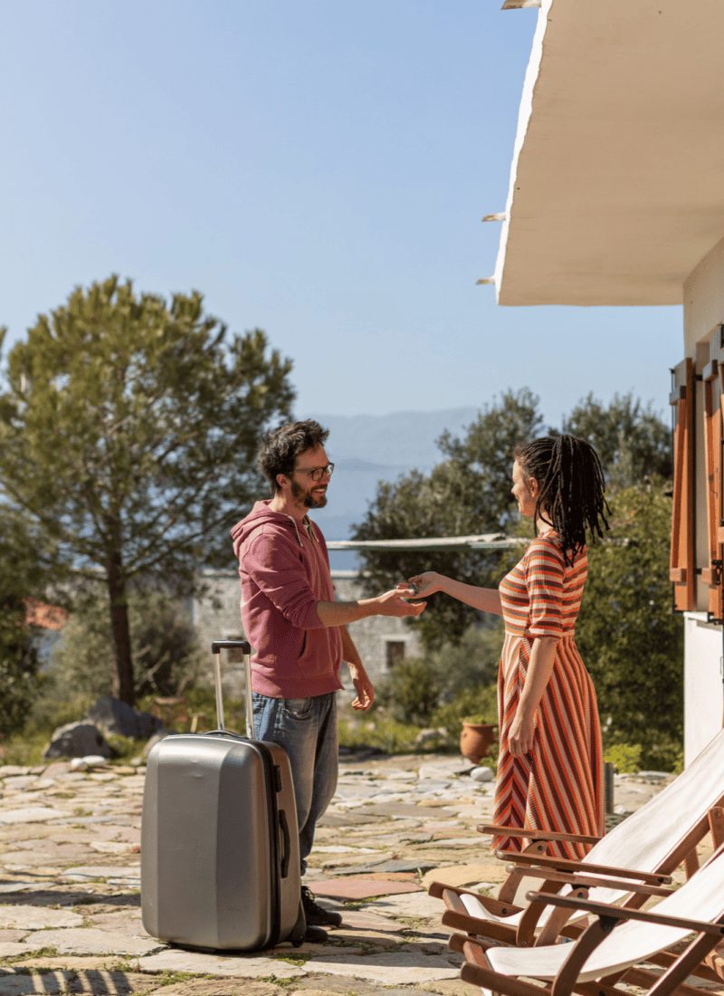 a man traveling meeting his airbnb